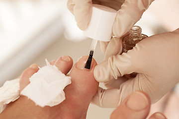 Image showing Applying nail polish during pedicure at beauty spa