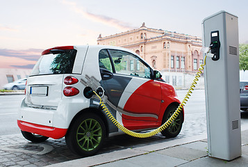 Image showing Electro car is charging on the street.