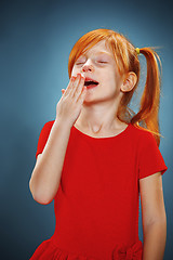 Image showing Beautiful portrait of a little yawning girl 