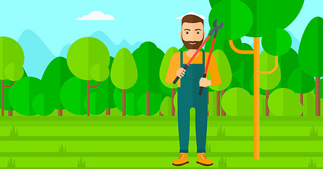 Image showing Farmer with pruner in garden.