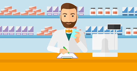 Image showing Pharmacist taking notes.