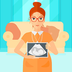 Image showing Pregnant woman with ultrasound image.