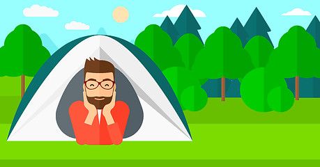 Image showing Man lying in tent.