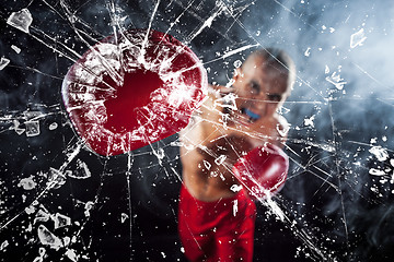 Image showing The boxer crushing a glass