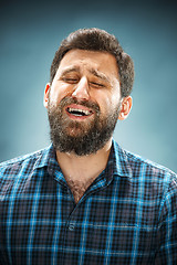 Image showing The crying man with tears on face closeup