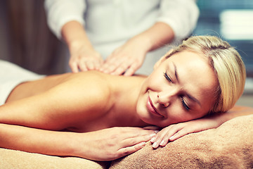 Image showing close up of woman lying and having massage in spa