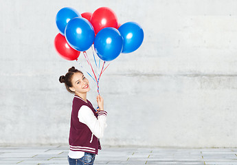 Image showing happy teenage girl with helium balloons