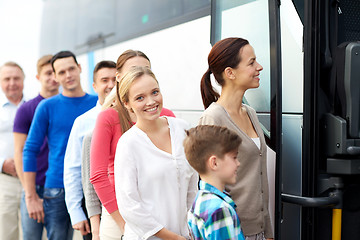 Image showing group of happy passengers boarding travel bus