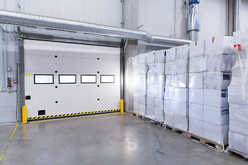 Image showing warehouse door or gate and cargo boxes