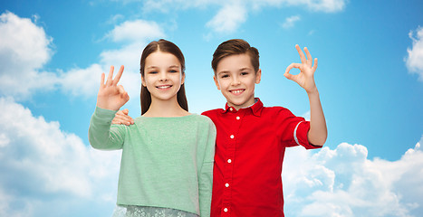 Image showing happy boy and girl showing ok hand sign