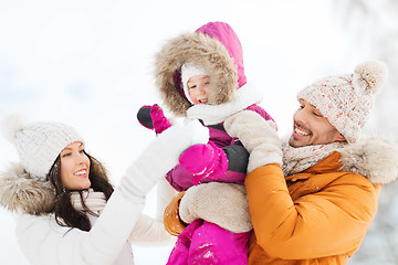 Image showing happy family with child in winter clothes outdoors