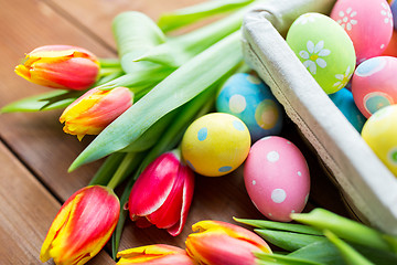 Image showing close up of colored easter eggs and flowers