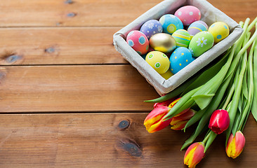 Image showing close up of colored easter eggs and flowers