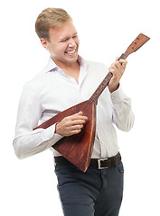 Image showing Excited young man playing balalaika, isolated on white