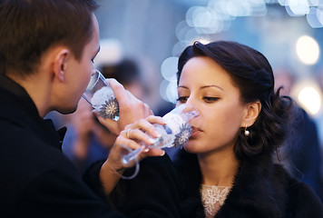 Image showing Couple toasting each other with champagne