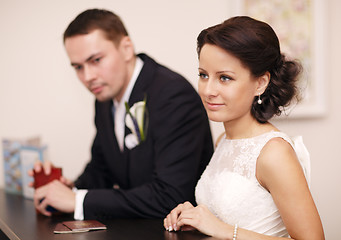 Image showing Couple at a reception desk with their passports