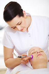 Image showing Cosmetician providing lifting procedure with special equipment