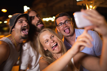 Image showing Young people taking crazy selfie with mobile