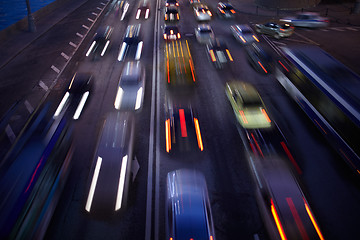 Image showing Car traffic at night. Motion blurred background.