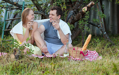 Image showing Young couple on picnic in the countryside