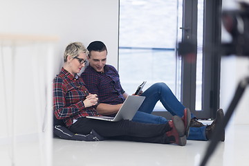 Image showing startup business, couple working on laptop computer at office