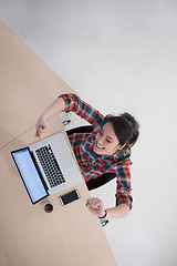 Image showing top view of young business woman working on laptop