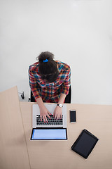 Image showing top view of young business woman working on laptop