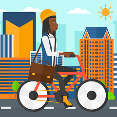 Image showing Woman cycling to work.