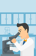 Image showing Laboratory assistant with microscope.