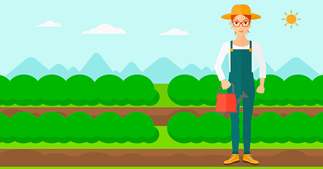 Image showing Farmer with watering can.