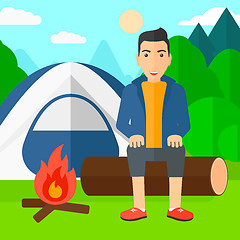 Image showing Man sitting at camp.