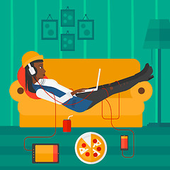 Image showing Woman lying on sofa with many gadgets.