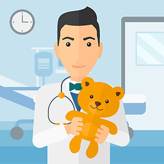 Image showing Pediatrician holding teddy bear.