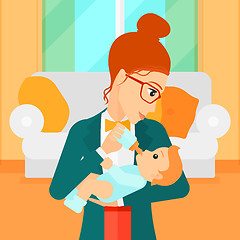 Image showing Woman feeding baby.