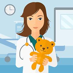 Image showing Pediatrician holding teddy bear.