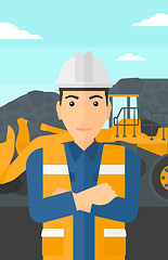 Image showing Miner with mining equipment on background.