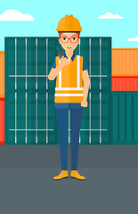 Image showing Stevedore standing on cargo containers background.