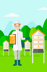 Image showing Bee-keeper at apiary.