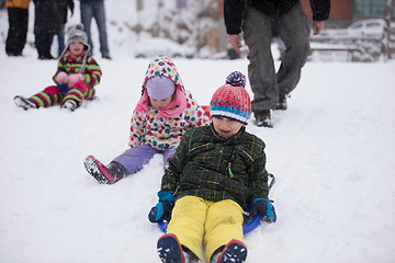 Image showing group of kids having fun and play together in fresh snow