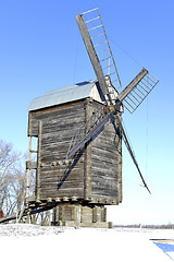 Image showing Old wooden windmill close up in winter