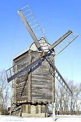 Image showing Old wooden windmill close up in winter