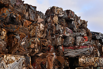 Image showing A pile of compressed cars in blocks for processing
