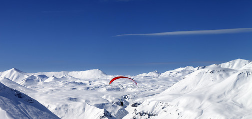 Image showing Panoramic view on sky gliding in snowy mountains