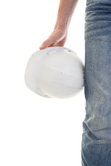 Image showing Male engineer in jeans holding white hardhat