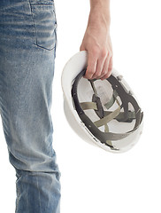 Image showing Male engineer in jeans holding white hardhat