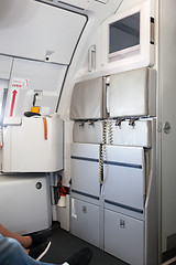 Image showing Seats for stewardesses in modern airplane