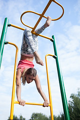 Image showing Beautiful young gymnast working out outdoors