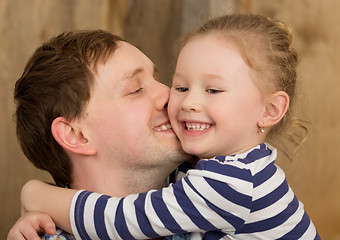 Image showing Happy father kissing little daughter