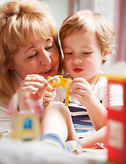 Image showing Grandmother playing with her grandson