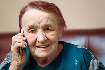 Image showing Elderly lady talking on a mobile phone